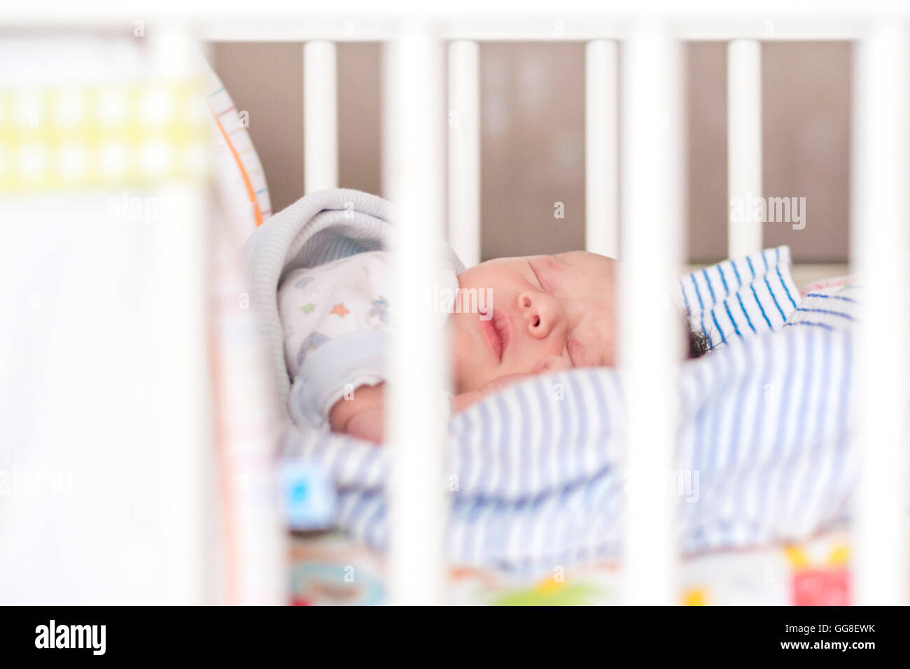 newborn child sleeping in white wooden crib Stock Photo - Alamy