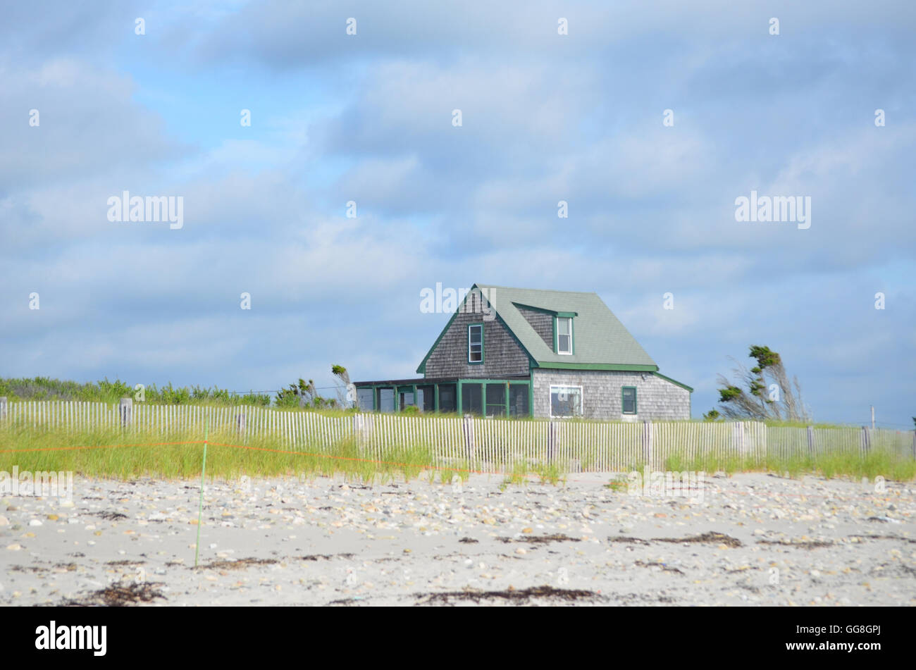 Adorable summer cottage on a perfect day on Duxbury Beach in