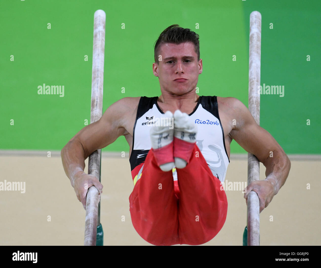Rio de Janeiro, Brazil. 3rd Aug, 2016. Lukas Dauser of Germany practices on parallel bars during a training session of the men's Artistic Gymnastics on pommel horse at Olympic Arena in Barra prior to the Rio 2016 Olympic Games in Rio de Janeiro, Brazil, 3 August 2016. Rio 2016 Olympic Games take place from 05 to 21 August. Photo: Bernd Thissen/dpa/Alamy Live News Stock Photo