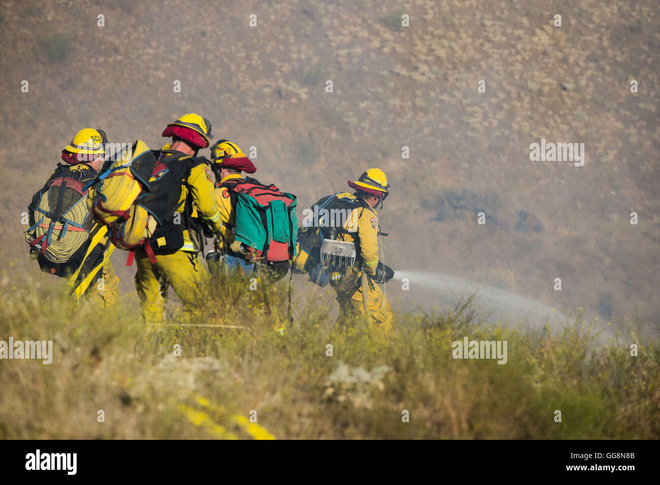 Diablo Grande, CA, USA. 3rd Aug, 2016. CalFire firefighters work the