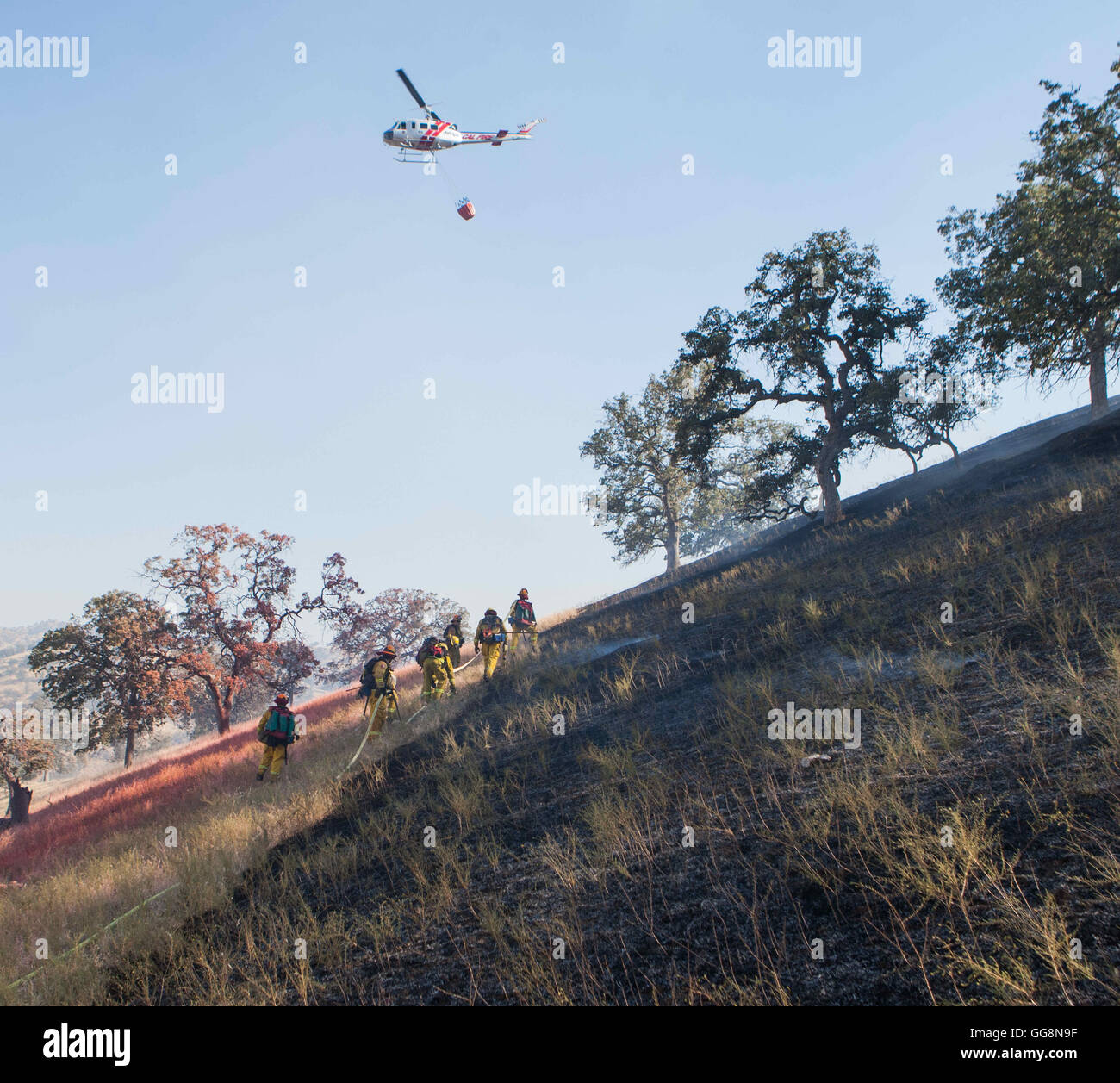 Diablo Grande, CA, USA. 3rd Aug, 2016. CalFire helitack 404 works with