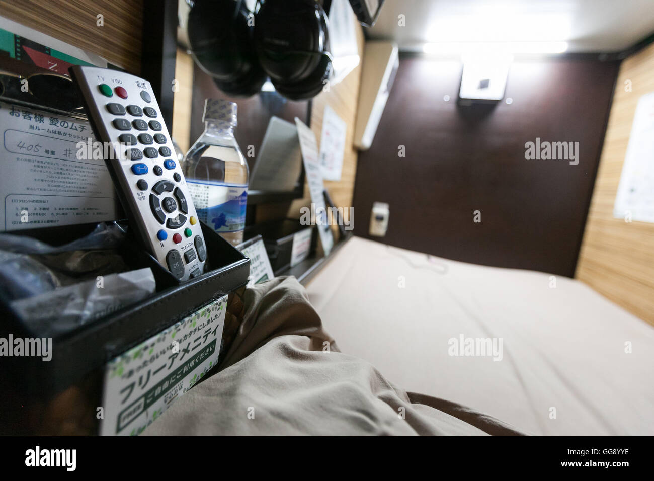 Anshin Oyado luxury capsule hotel located within 3-minutes of the busy Shinjuku station on August 7, 2016, Tokyo, Japan. The new take on the traditional Japanese capsule hotel offers larger capsules, free artificial hot springs & mist sauna, internet cafe and Wi-Fi. This hotel is male only and rates start at 5480 yen (54USD). Each of the hotel's 256 capsules is equipped with fire alarm, air conditioner, tablet computer and flat-screen TV. Public areas such as the hot springs bath, laundromat, clothing shop and snack and drinks vending machines are open 24 hours. The hotel's website is in Chine Stock Photo