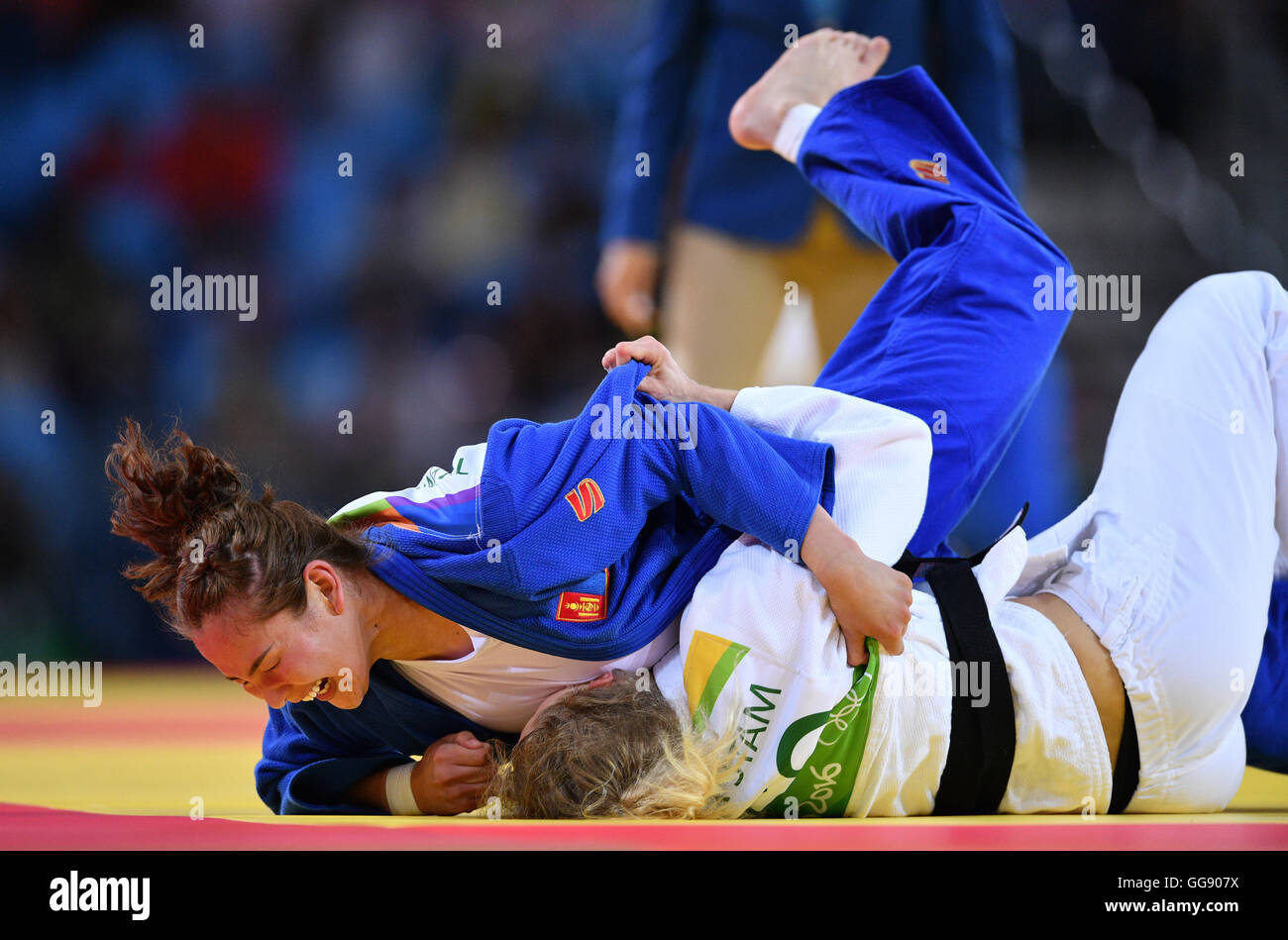 Rio de Janeiro, Brazil. 10th Aug, 2016. Naranjargal Tsend-Ayush of Mongolia (blue) celebrates against Esther Stam of Georgia during the Women -70 kg Elimination Round of 32 of the Judo event during the Olympic Games at Carioca Arena 2 in Rio de Janeiro, Brazil, 10 August 2016. Photo: Lukas Schulze/dpa/Alamy Live News Stock Photo