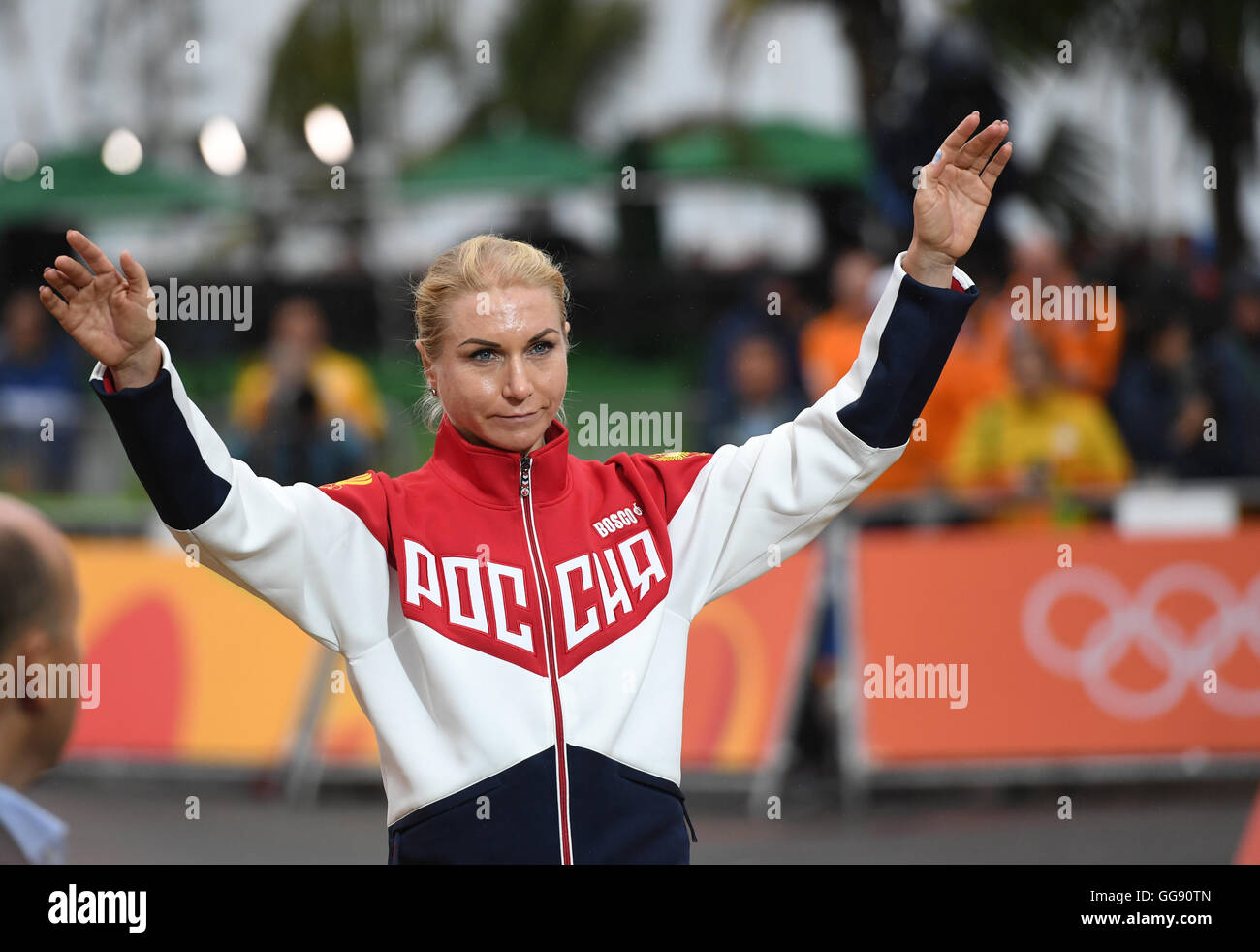 Rio de Janeiro, Brazil. 10th Aug, 2016. Second placed Olga Zabelinskaya (L) of Russia celebrates on the podium after the women's Individual Time Trial of the Rio 2016 Olympic Games Road Cycling events at Pontal in Rio de Janeiro, Brazil, 10 August 2016. APhoto: Soeren Stache/dpa/Alamy Live News Stock Photo