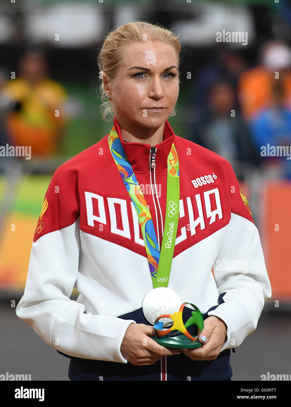 Rio de Janeiro, Brazil. 10th Aug, 2016. Second placed Olga Zabelinskaya of Russia celebrates on the podium after the women's Individual Time Trial of the Rio 2016 Olympic Games Road Cycling events at Pontal in Rio de Janeiro, Brazil, 10 August 2016. APhoto: Soeren Stache/dpa/Alamy Live News Stock Photo