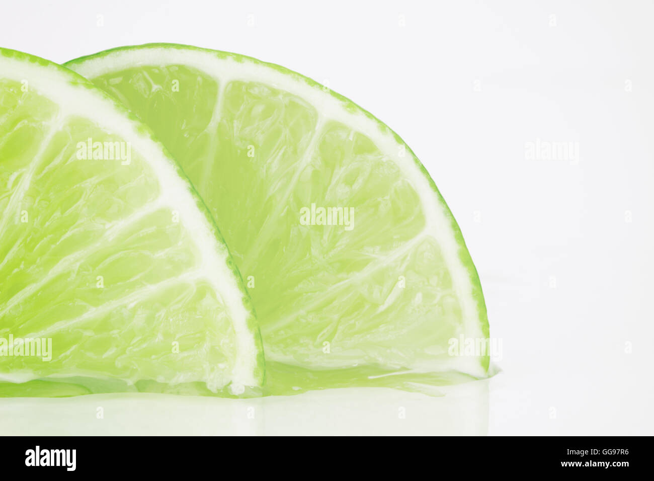 Close up of sliced lime pieces with copy space Stock Photo