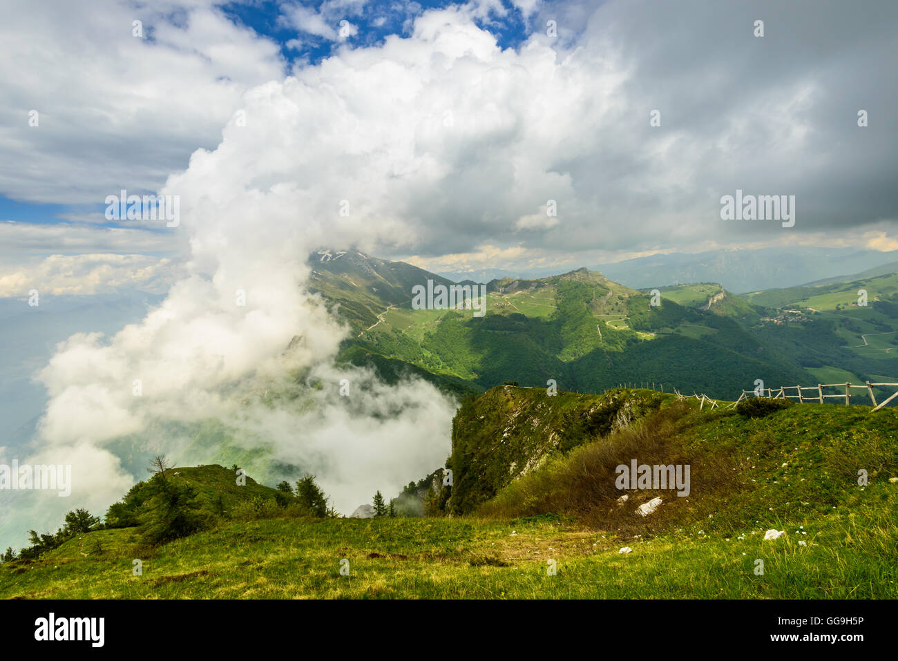 Forming clouds on the top of Monte Baldo in the Italian Alps near Malcesine on the eastern shore of Lake Garda Stock Photo