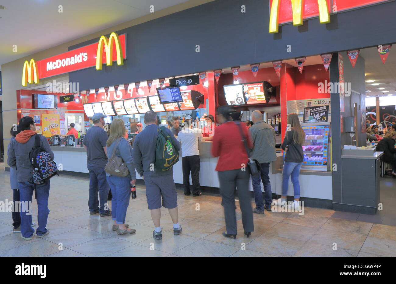 People queue at Mcdonalds at Melbourne Airportin Melbourne Australia. Stock Photo