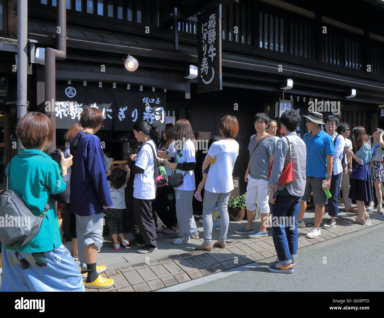 People queue to buy famous Hida beef Sushi in Takayama Japan Stock Photo