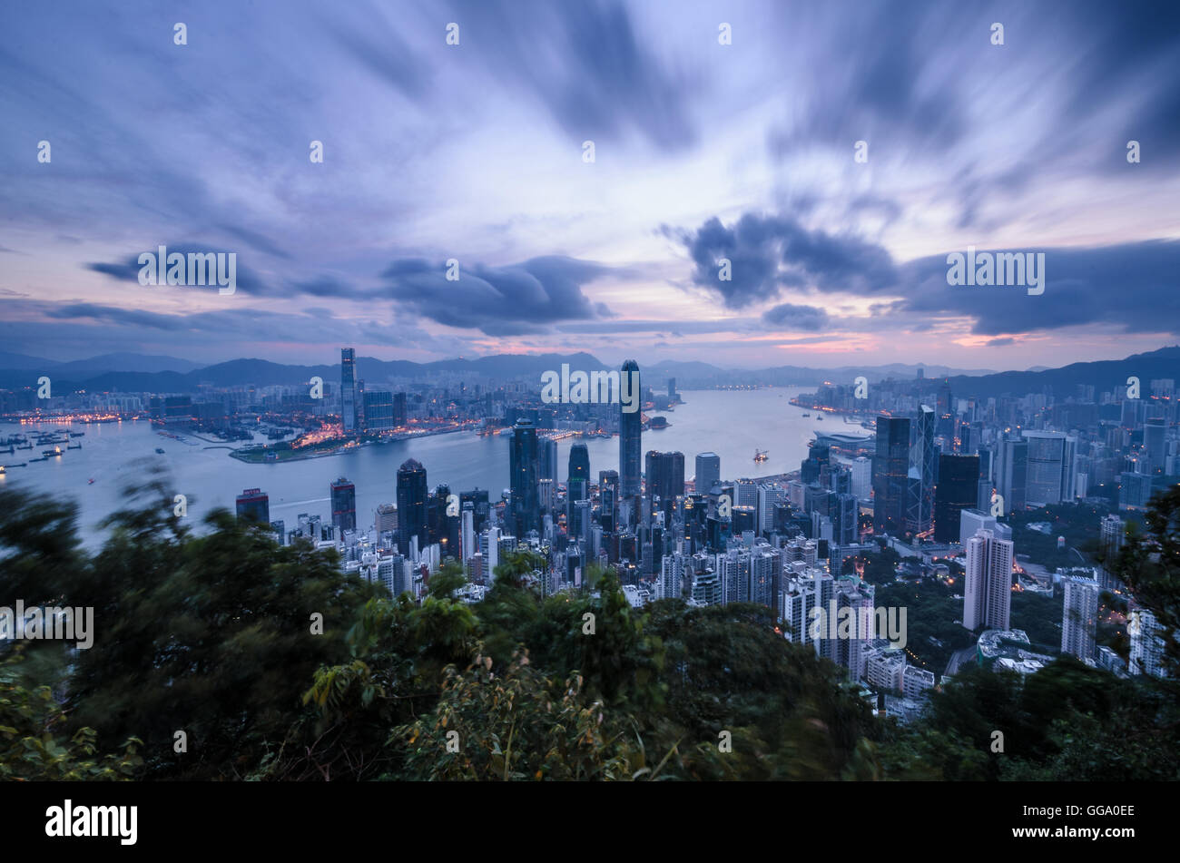 Hong Kong skyline and Victoria Harbour at sunrise from Lugard Road on ...