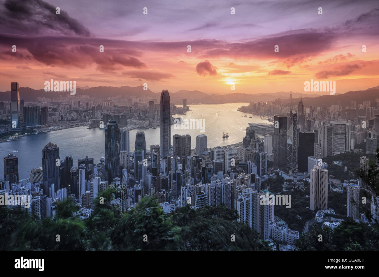 Hong Kong skyline and Victoria Harbor at sunrise from Lugard Road on ...
