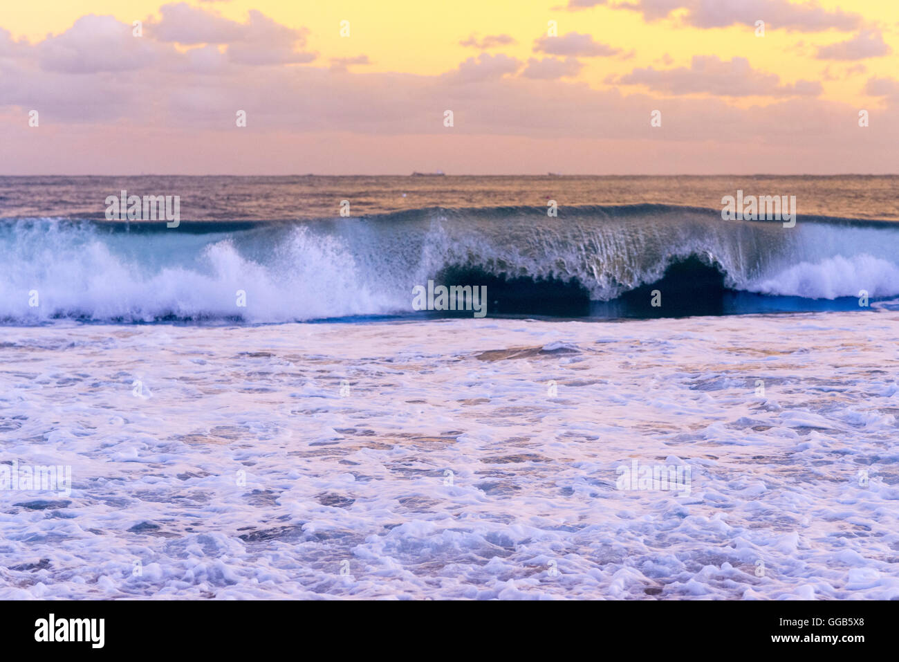evening glow, breaking waves at the beach with colored filters, backgrounds Stock Photo
