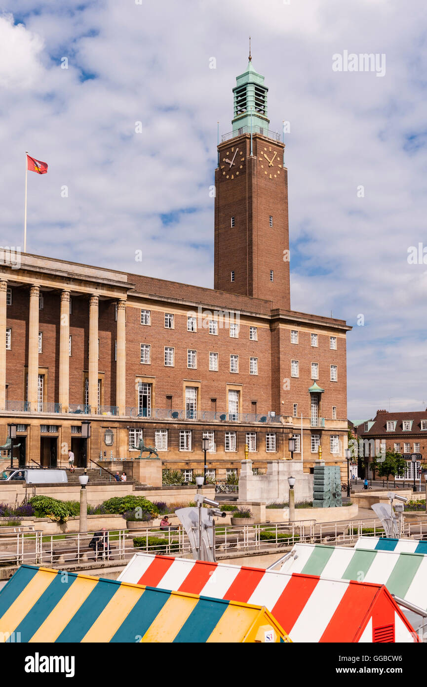 The city hall clock tower over the market in Norwich , Norfolk