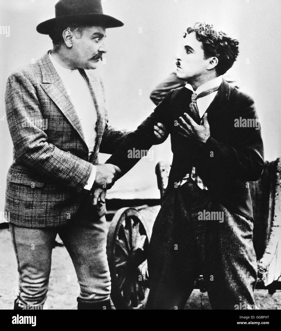 THE CIRCUS / USA 1928 / Charles Chaplin The Ringmaster (AL ERNEST GARCIA) and the Tramp (CHARLES CHAPLIN) Regie: Charles Chaplin Stock Photo