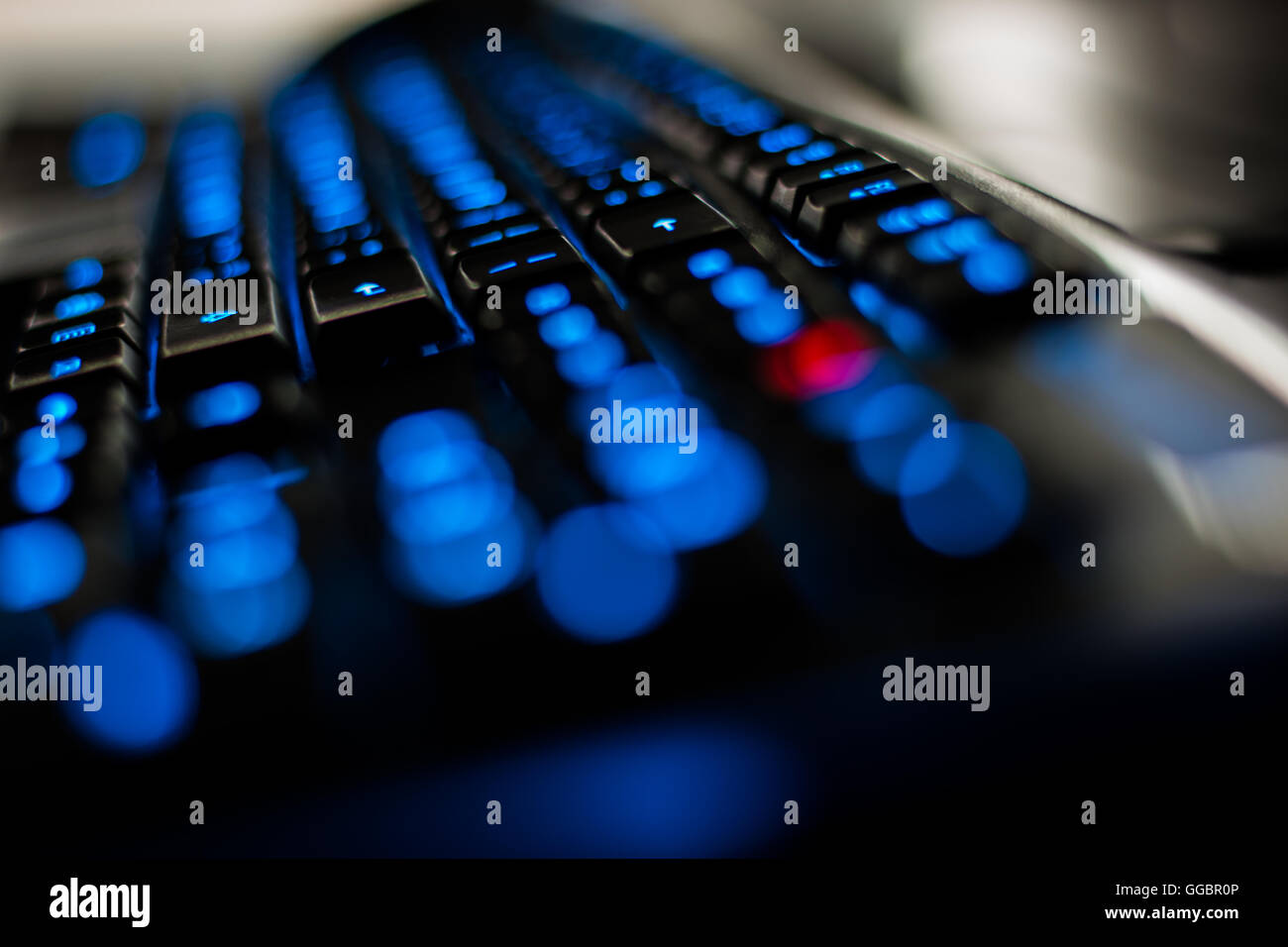 Computer keyboard glows red with a blue illuminated euro symbol. News Photo  - Getty Images