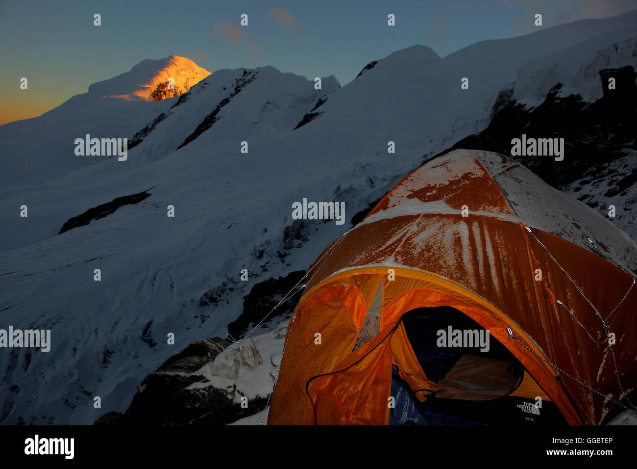 Dusk view from high camp - Mera peak - Climbers tents in foreground Stock Photo