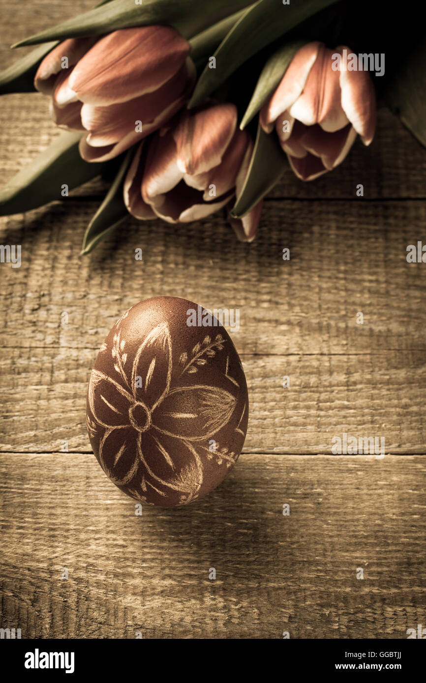 Easter egg and tulips on wooden background Stock Photo - Alamy
