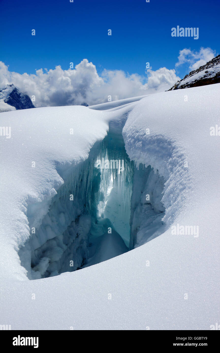 View into Crevice in snow fields below Mera peak Stock Photo