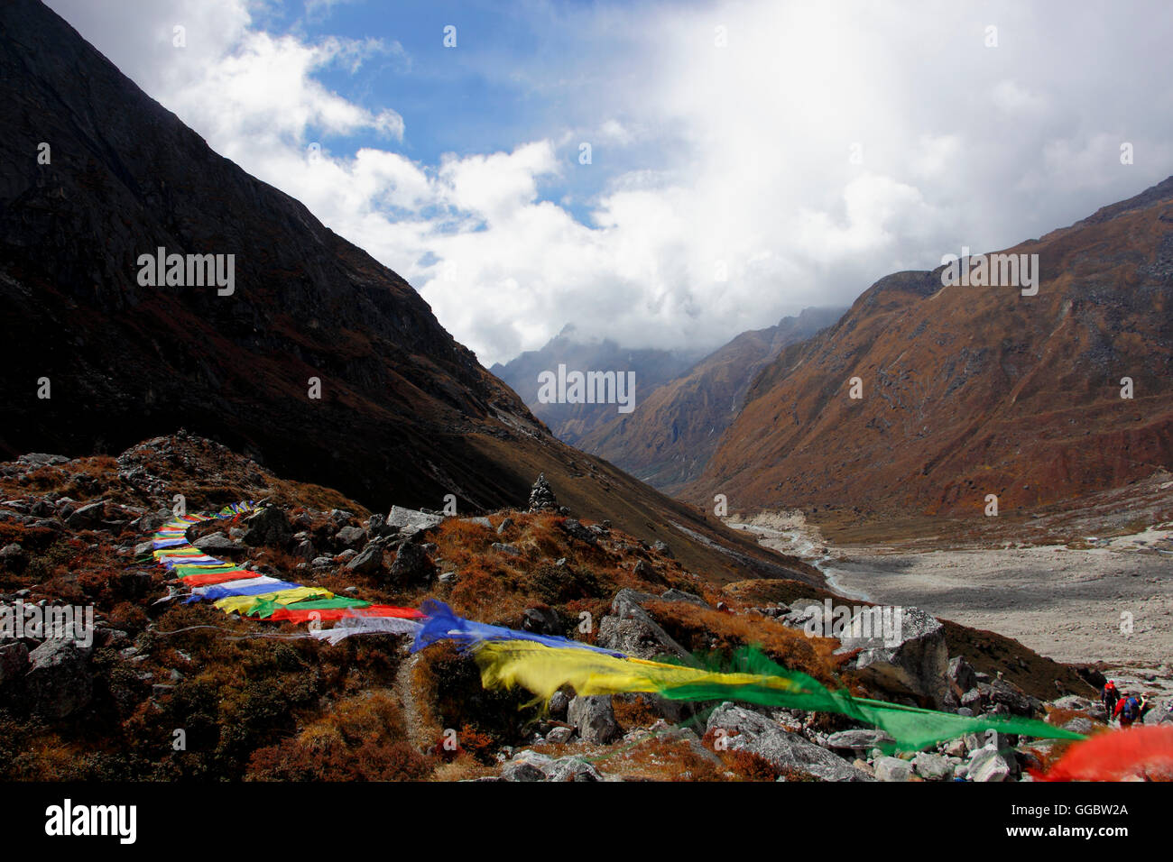View of Tibetan prayer flags Near Tangnag with Mera mountain system backdrop and Hinku Valley Stock Photo