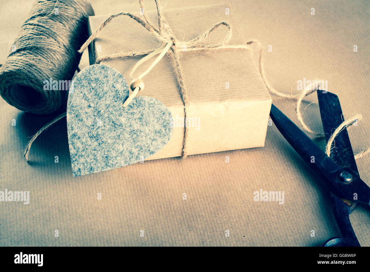 Scissors, Tape, Ribbon And Wrapping Paper On A Gift Box. Focus On