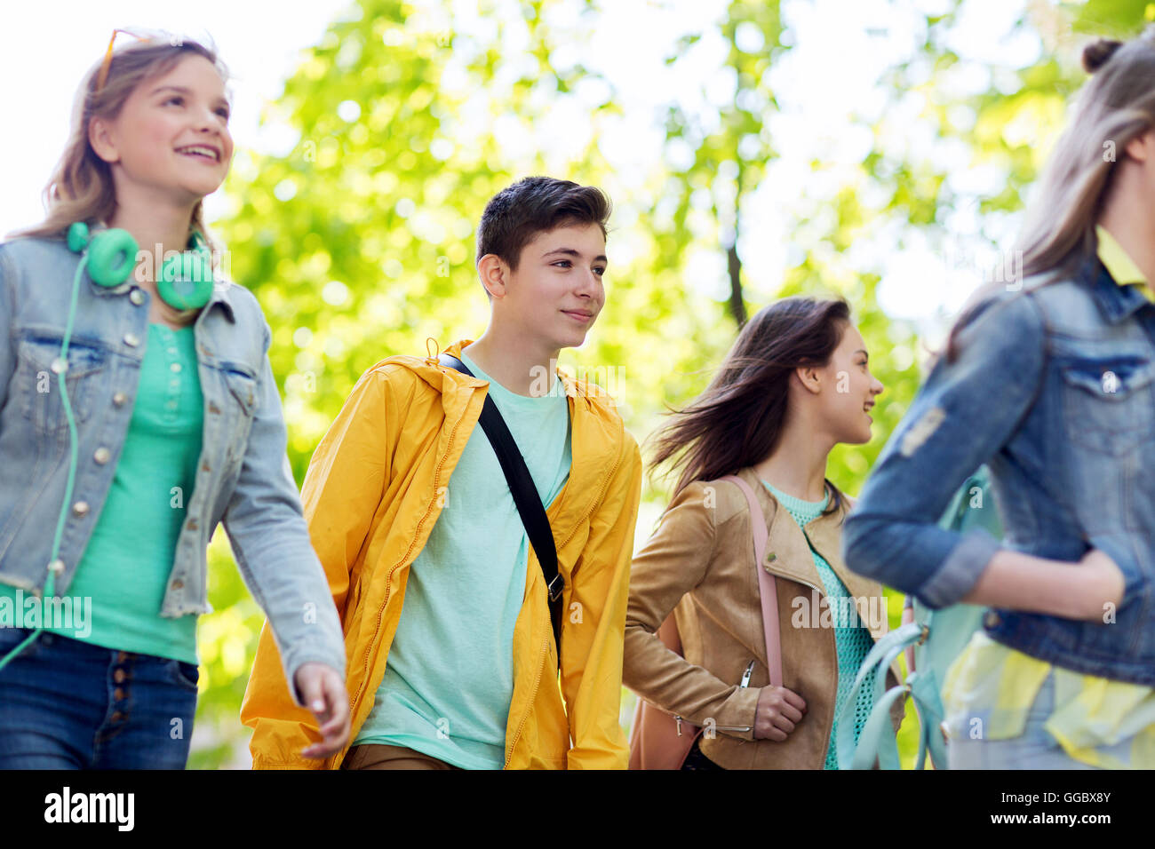 group of happy teenage students walking outdoors Stock Photo - Alamy