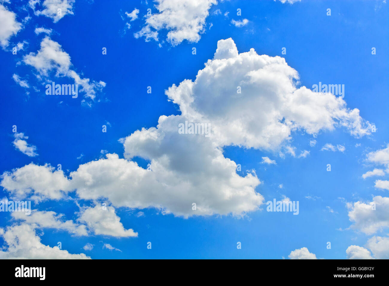 Summer day and the white clouds that travel blue sky. Stock Photo
