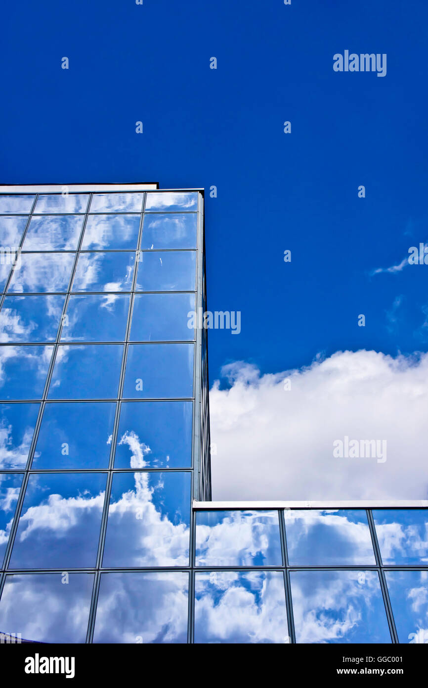 modern building with reflective panels and clouds reflected into it Stock Photo