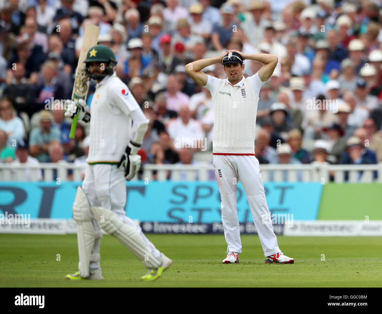 England captain Alastair Cook shows his dejection as Pakistan batsman Azhar Ali adds to his score during day two of the 3rd Investec Test Match at Edgbaston, Birmingham. Stock Photo