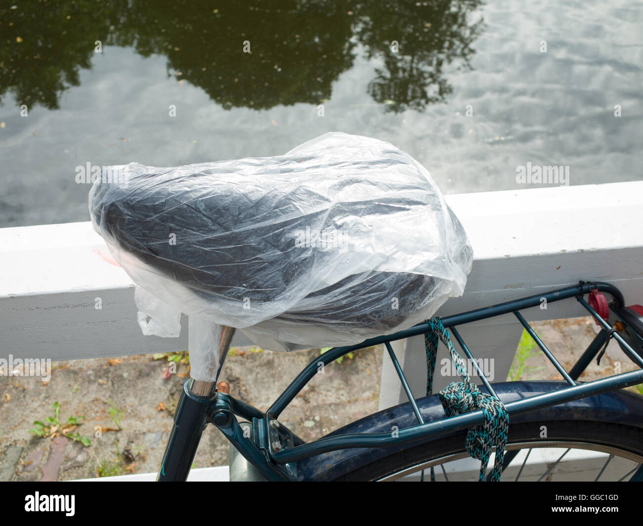Plastic bag to keep bicycle saddle dry Stock Photo