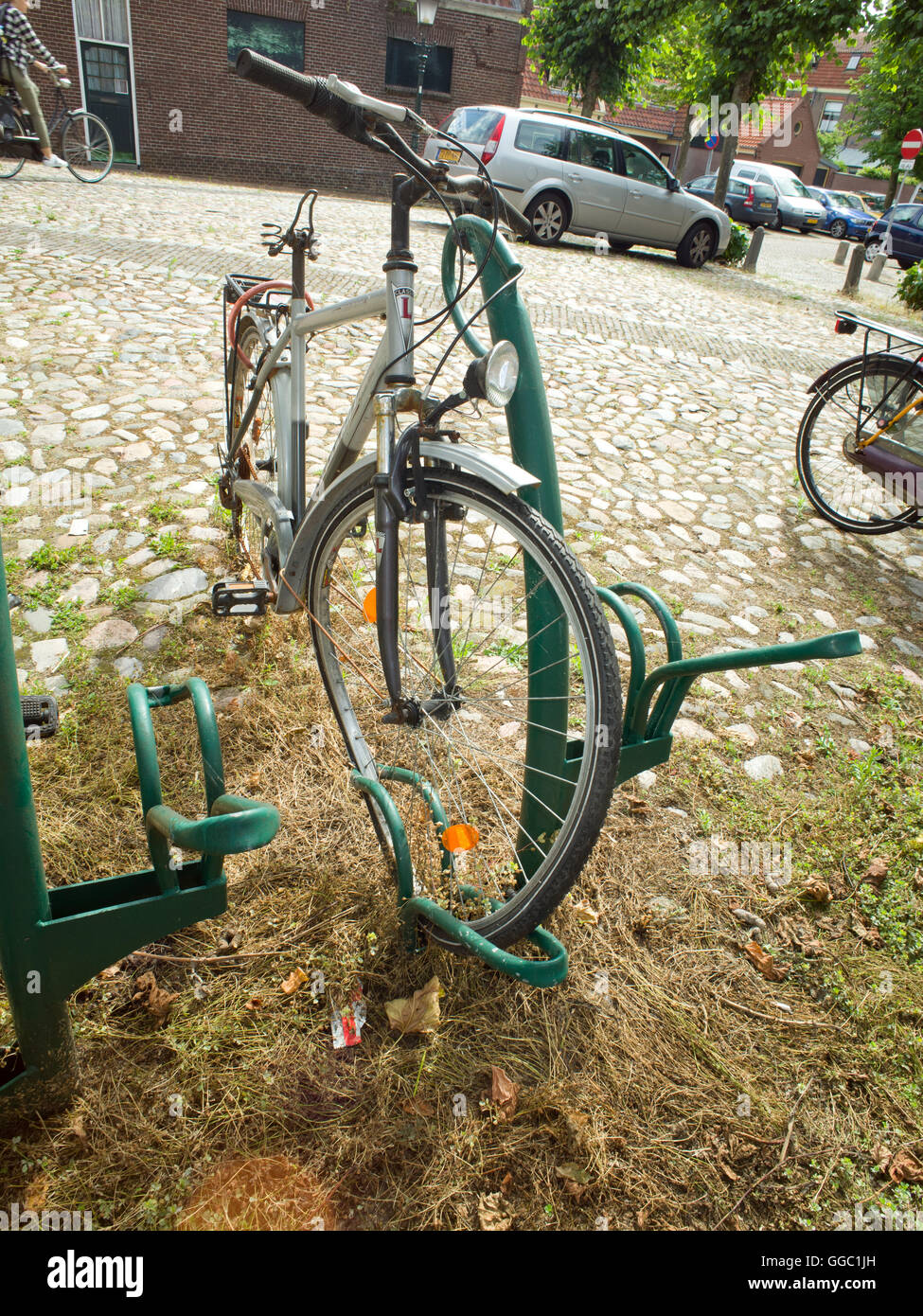 Buckled bike wheel Stock Photo