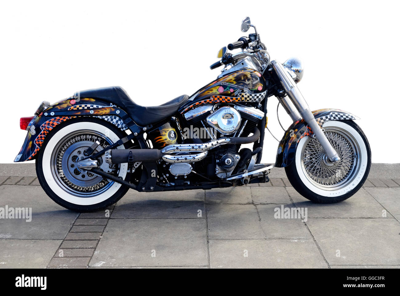 A highly customized Harley Davidson Motorcycle parked on a Dublin street, shown as a partial cut-out Stock Photo