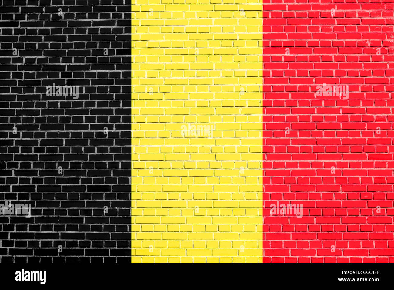 Flag of Belgium on brick wall texture background. Belgian national flag. Stock Photo