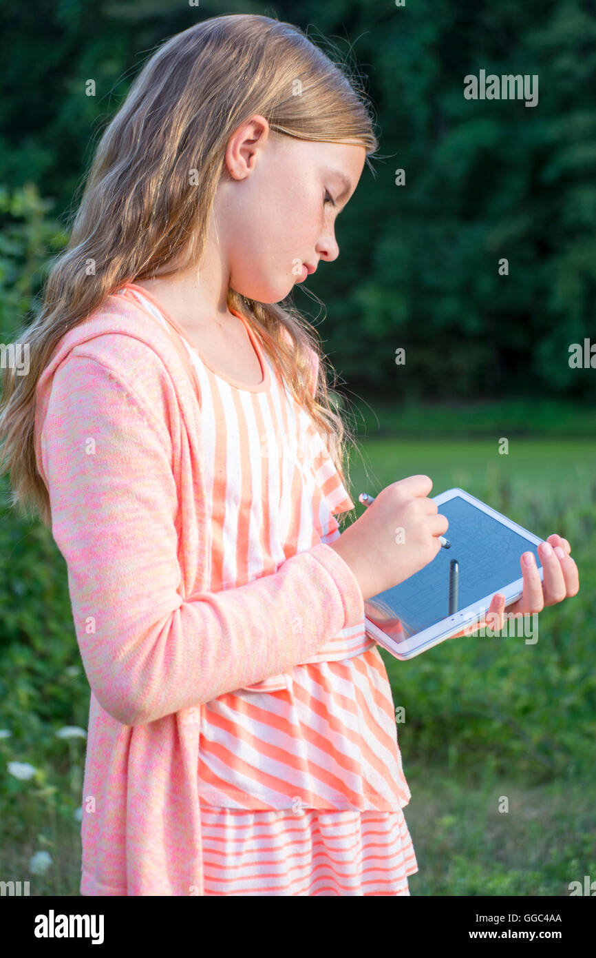 Girl with tablet drawing Stock Photo Alamy