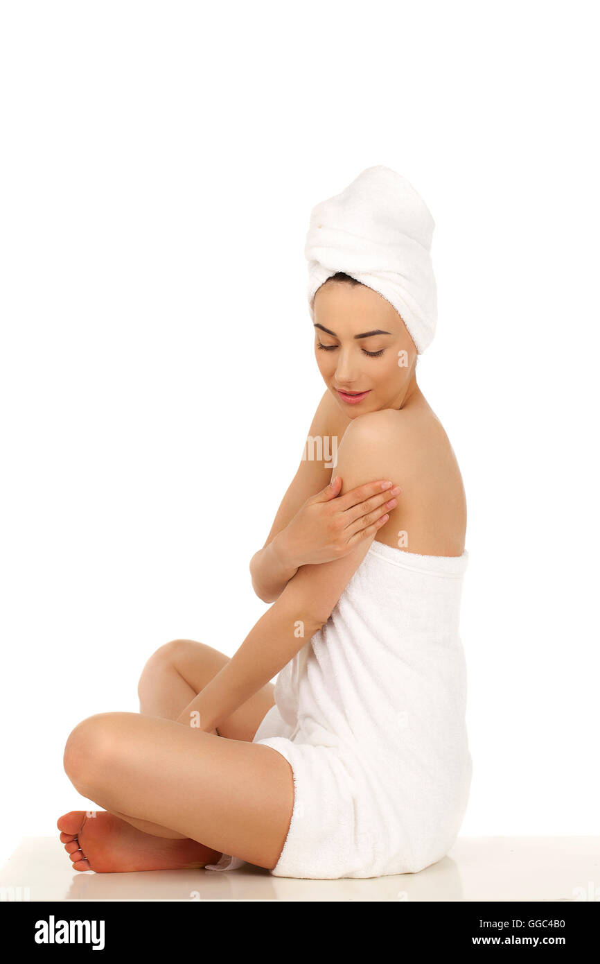 Full length portrait of a beautiful young woman wrapped towel isolated ...