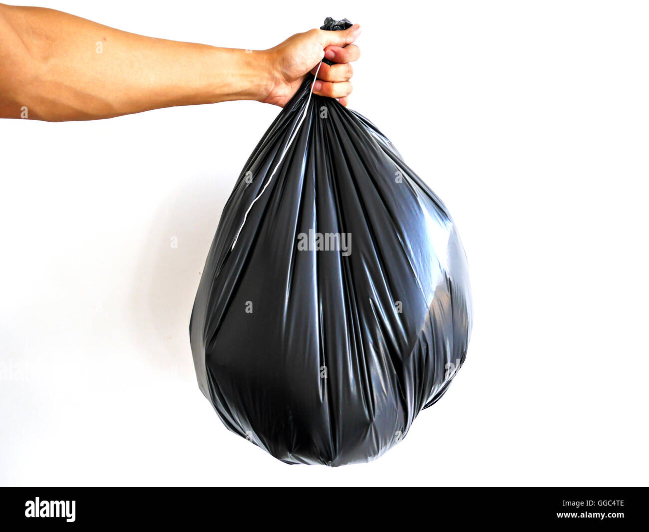 Right hand hold big garbage bag isolated on white background Stock