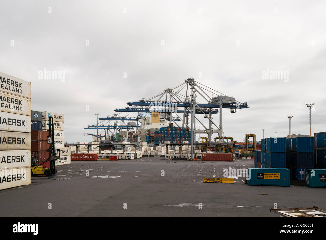 AUCKLAND, NZL -JAN 13 2016:Big cargo ship unloading containers in Ports of Auckland New Zealand. New Zealand's busiest port and Stock Photo