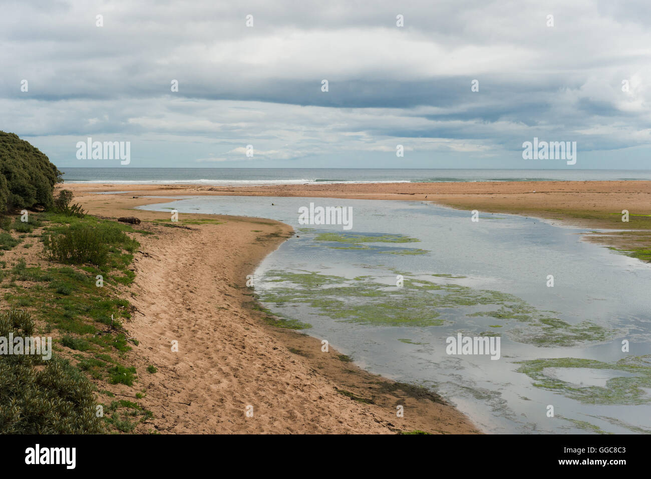 River flowing into sea at Scoughall in East Lothian Stock Photo
