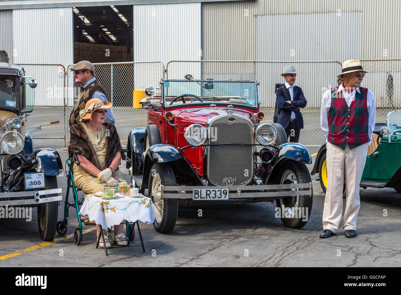 Drivers and dame dressed in 1930s attire would chauffeur paying passengers around Stock Photo