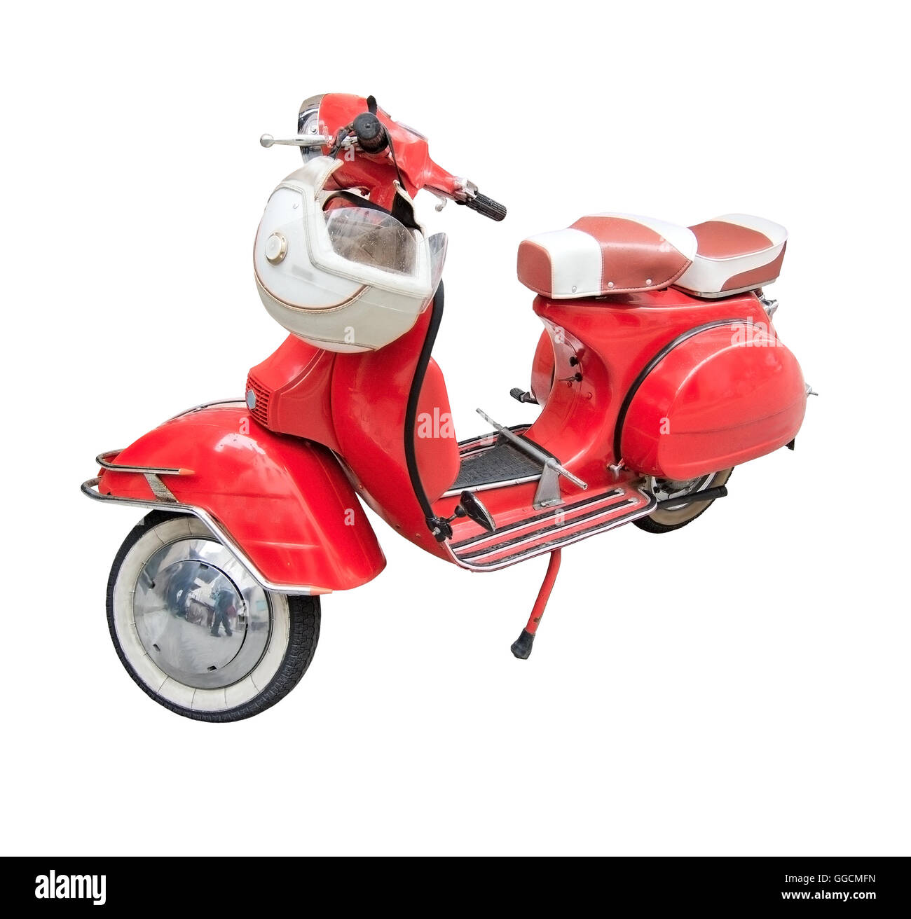 Red vintage scooter with helmet isolated on white. Stock Photo
