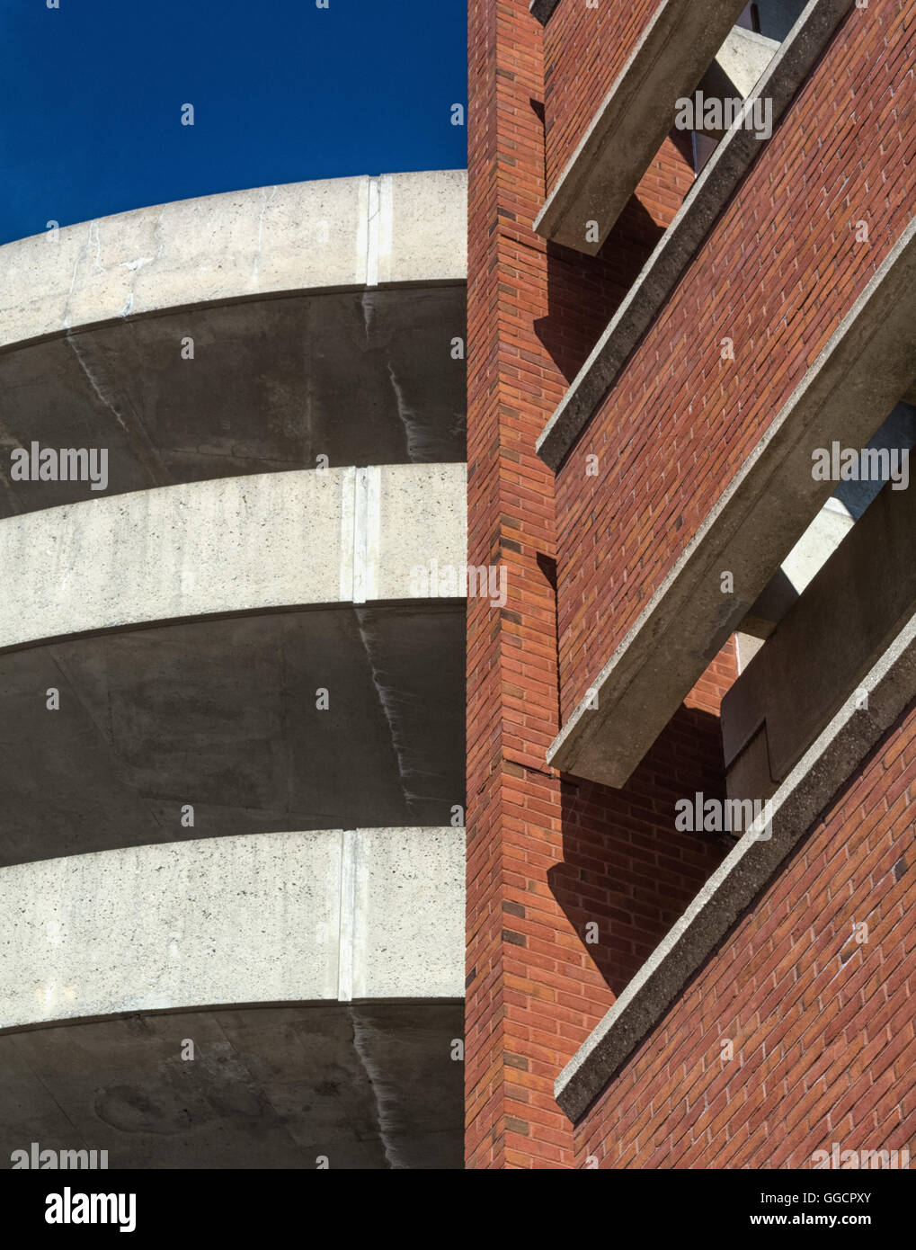 Sweeping curves of concrete meet linear lines of brick Stock Photo Alamy