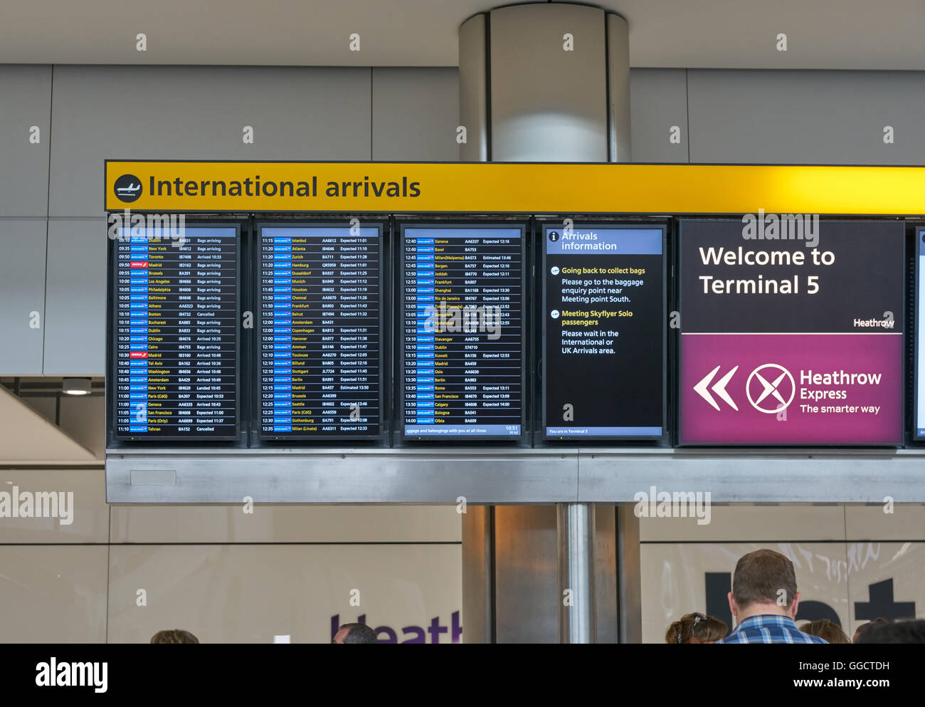 arrivals board at airport,  heathrow arrivals,  airplane arrivals terminal 5 Stock Photo