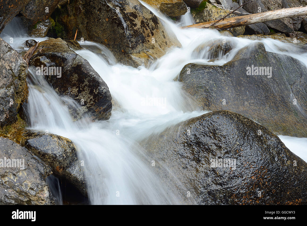 Flowing water and rocks Stock Photo