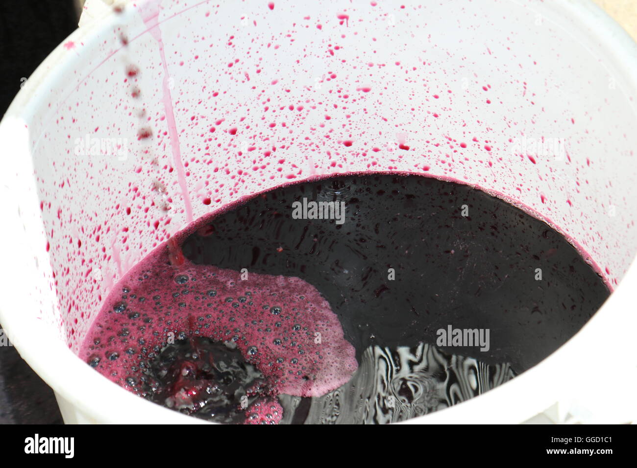Red wine juice in a bucket at Two Hands Wines, Australia Stock Photo