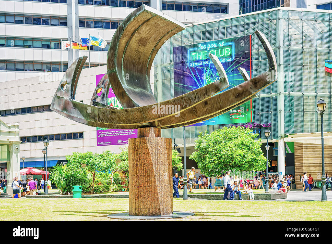 Singapore, Singapore - March 1, 2016: Ship sculpture at MRT subway entrance at One Raffles Place in Financial Center of Singapore. People in the street. Stock Photo