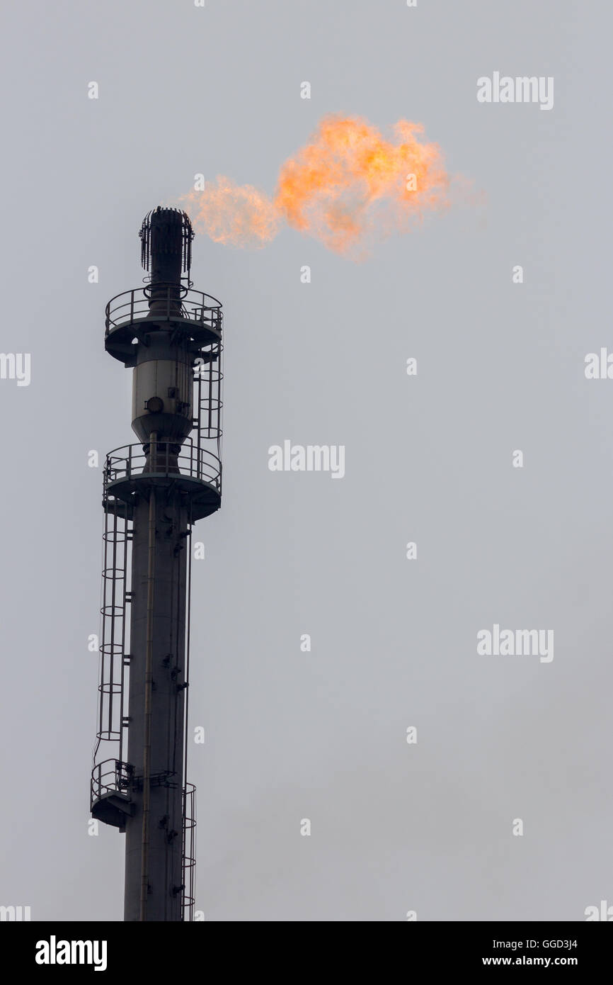 Gas flare at a refinery Stock Photo