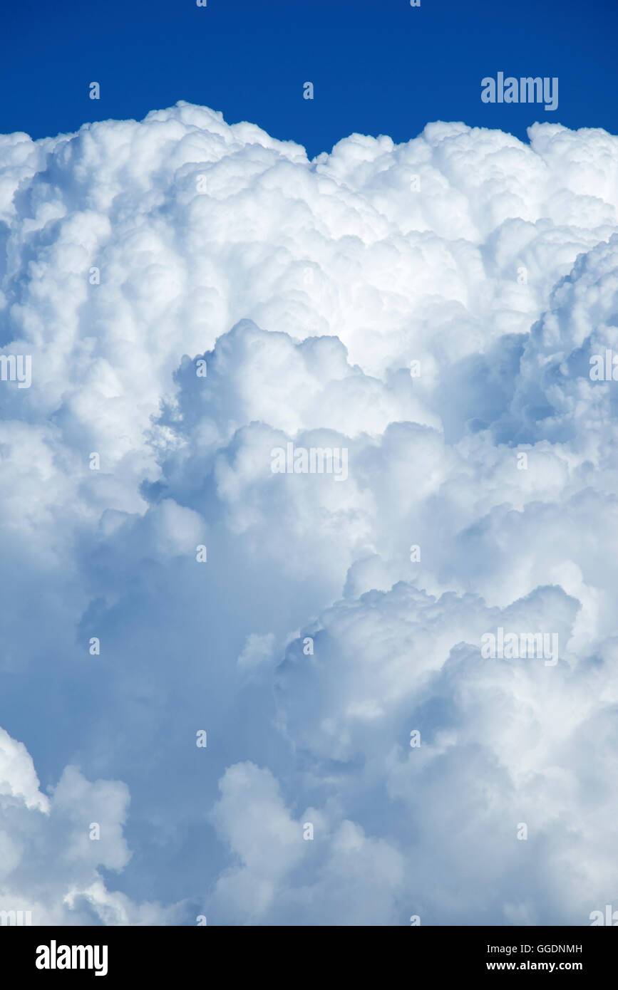 Aerial view of puffy cumulus clouds and deep blue sky taken from high altitude balloon Stock Photo