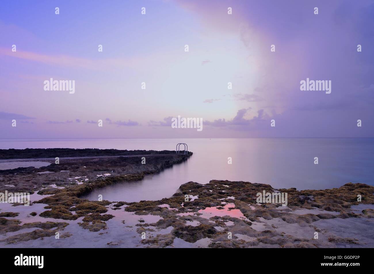 Long exposure photograph of rockpools outside Grape Tree Villas, Seven Mile Beach, Grand Cayman, Cayman Islands, Caribbean. Stock Photo