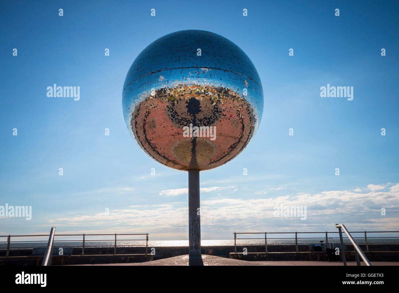 reflective mirrored ball sculpture on Blackpool beach front Stock Photo