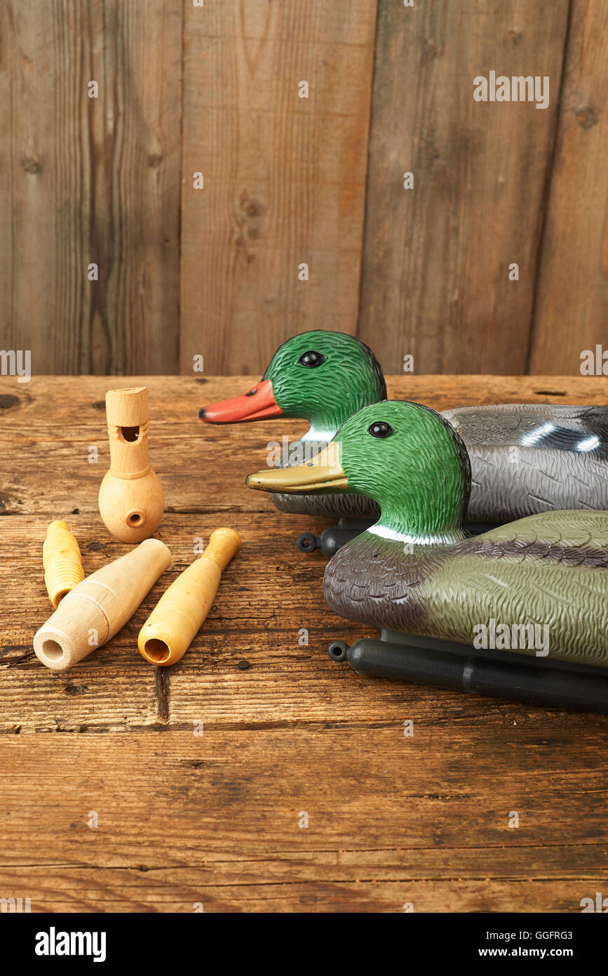 Hunting. Duck decoys and wooden whistles Stock Photo Alamy