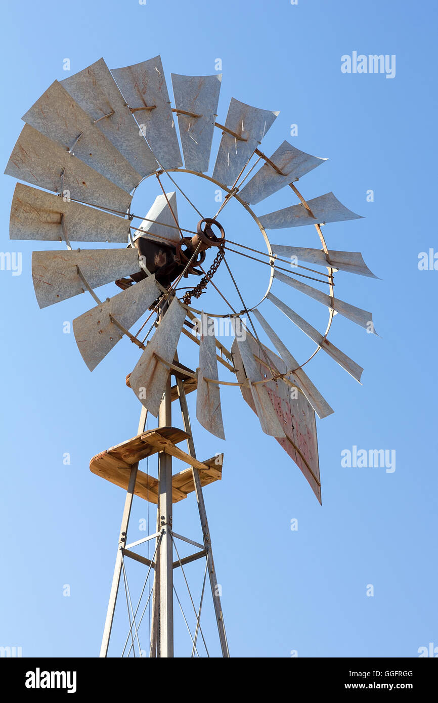 Windmill for Water Pump Well at Wheat Field in Central Oregon Closeup Stock Photo